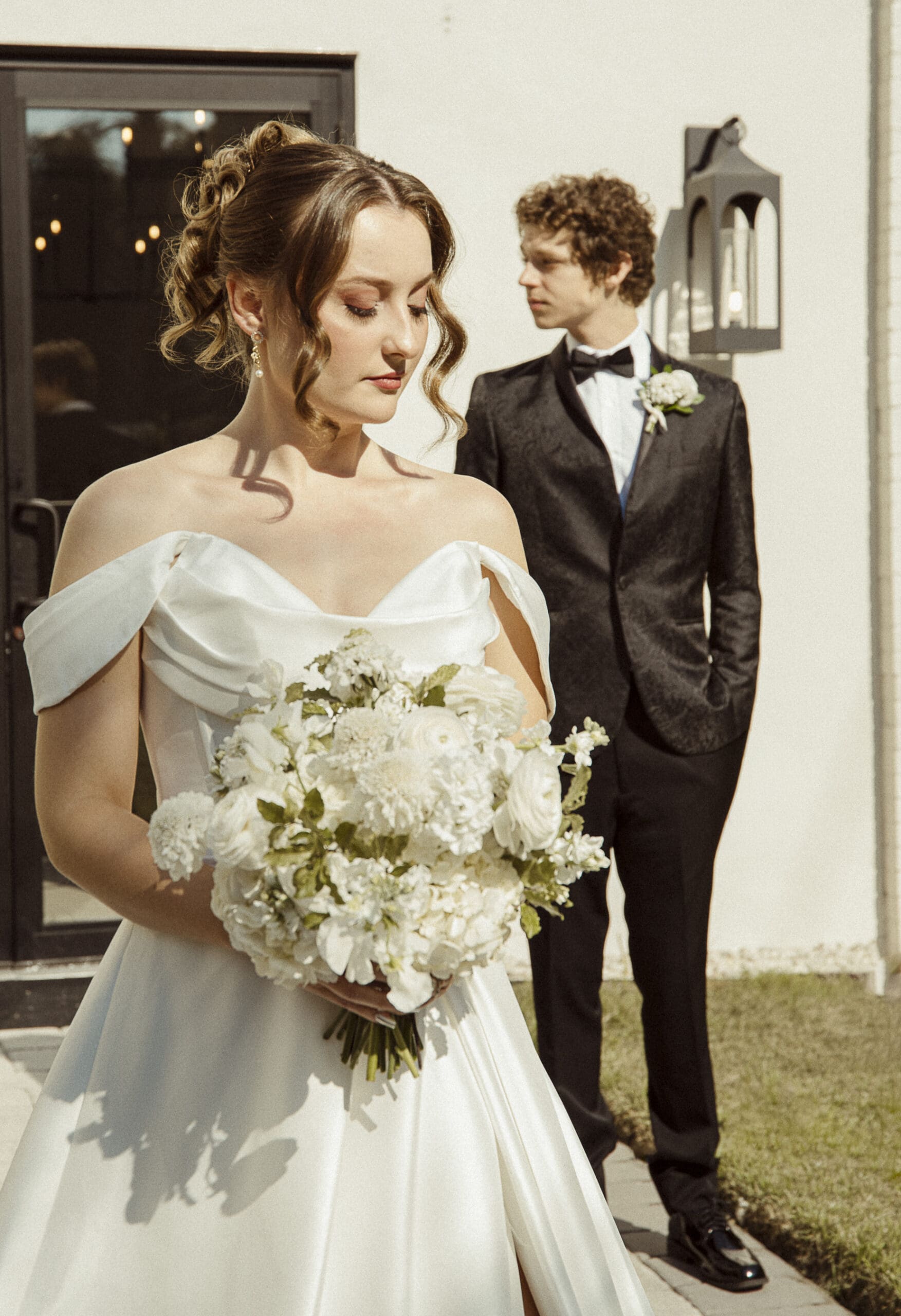 Bride and groom posed for an editorial-style wedding portrait captured by St. Augustine wedding photographer Brandi Denslow.