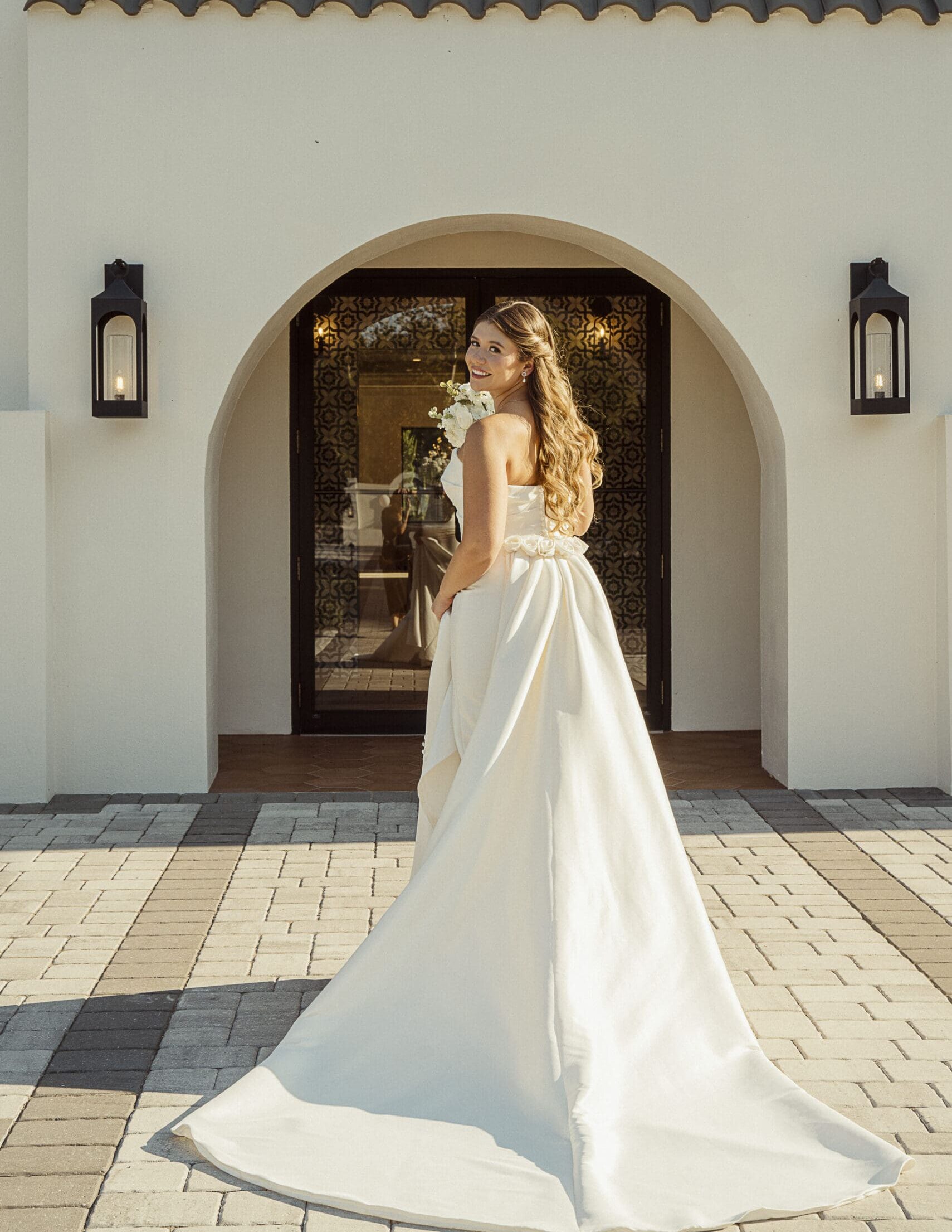Bride portrait framed by an elegant archway photographed by a St. Augustine wedding photographer.