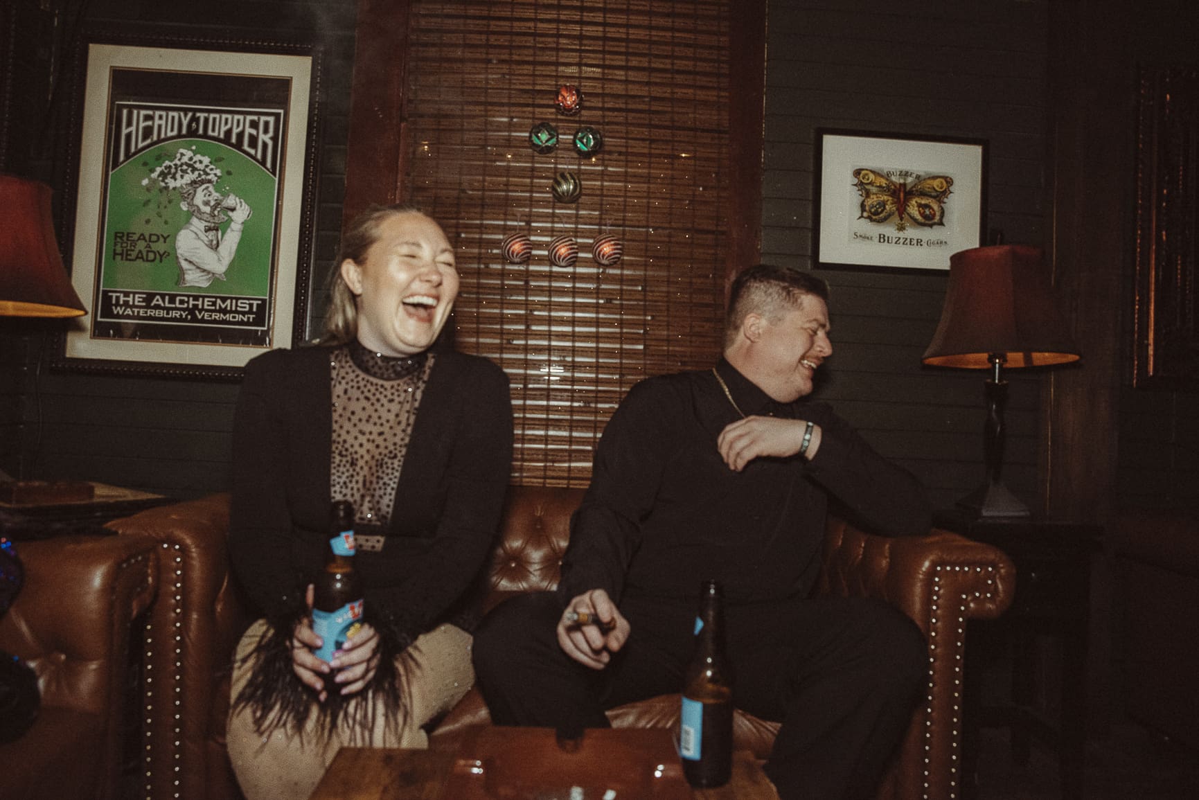 Couple laughing together during their wedding reception, captured candidly because the timeline allowed space for real connection and spontaneity. 
