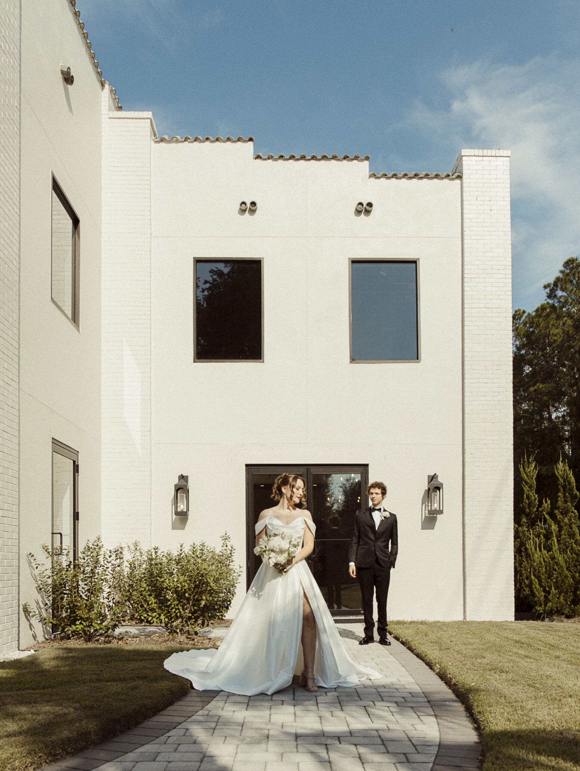  Bride and groom portrait in the courtyard of the Old Spanish Quarter under a clear blue sky