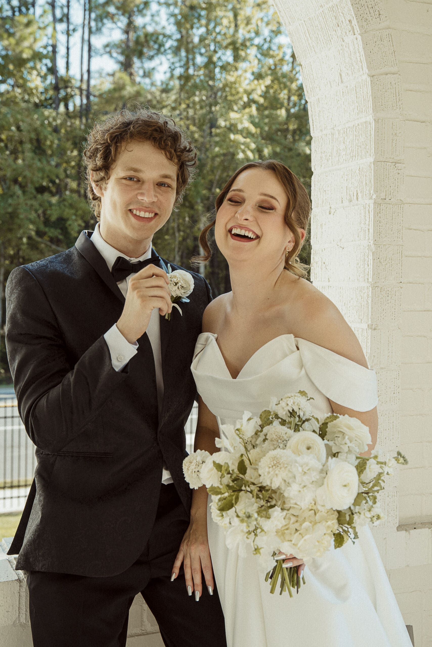 Joyful newly married couple celebrating after their St. Augustine wedding ceremony.