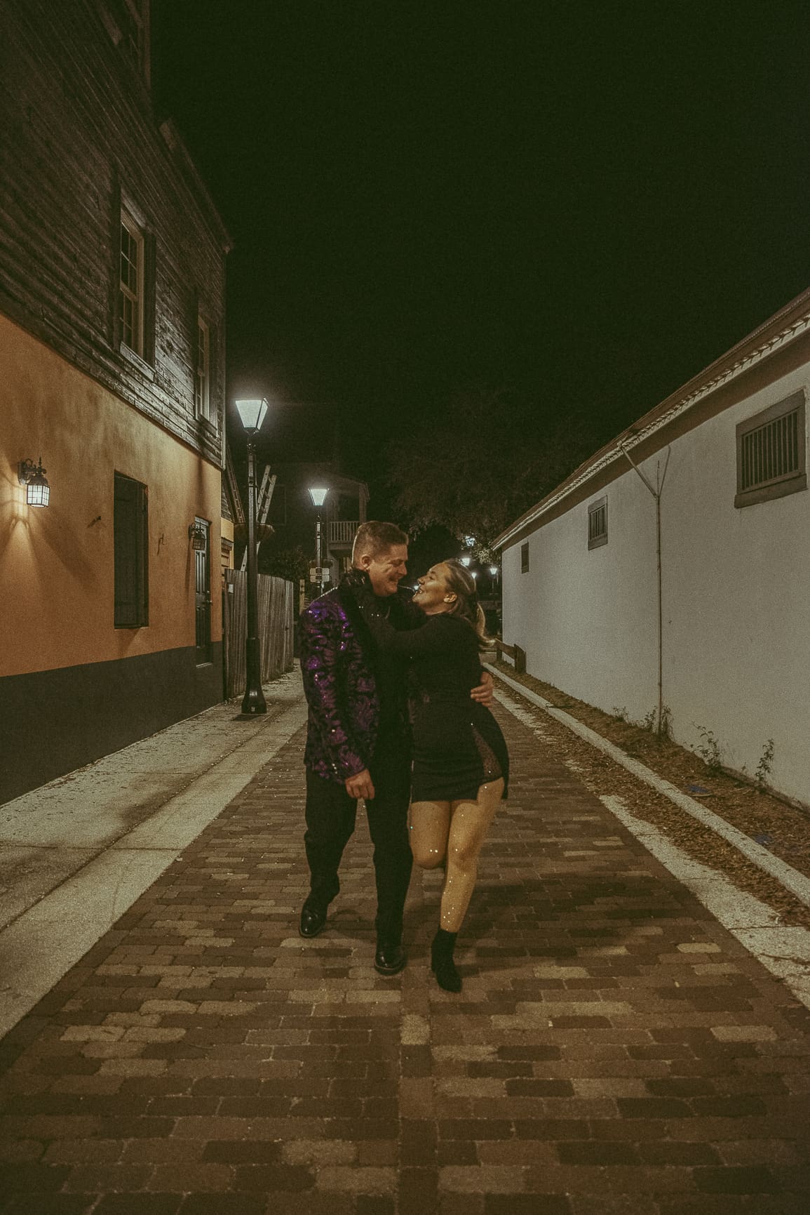 Couple walking hand in hand during a downtown St. Augustine intimate wedding, photographed in a natural and unposed moment
