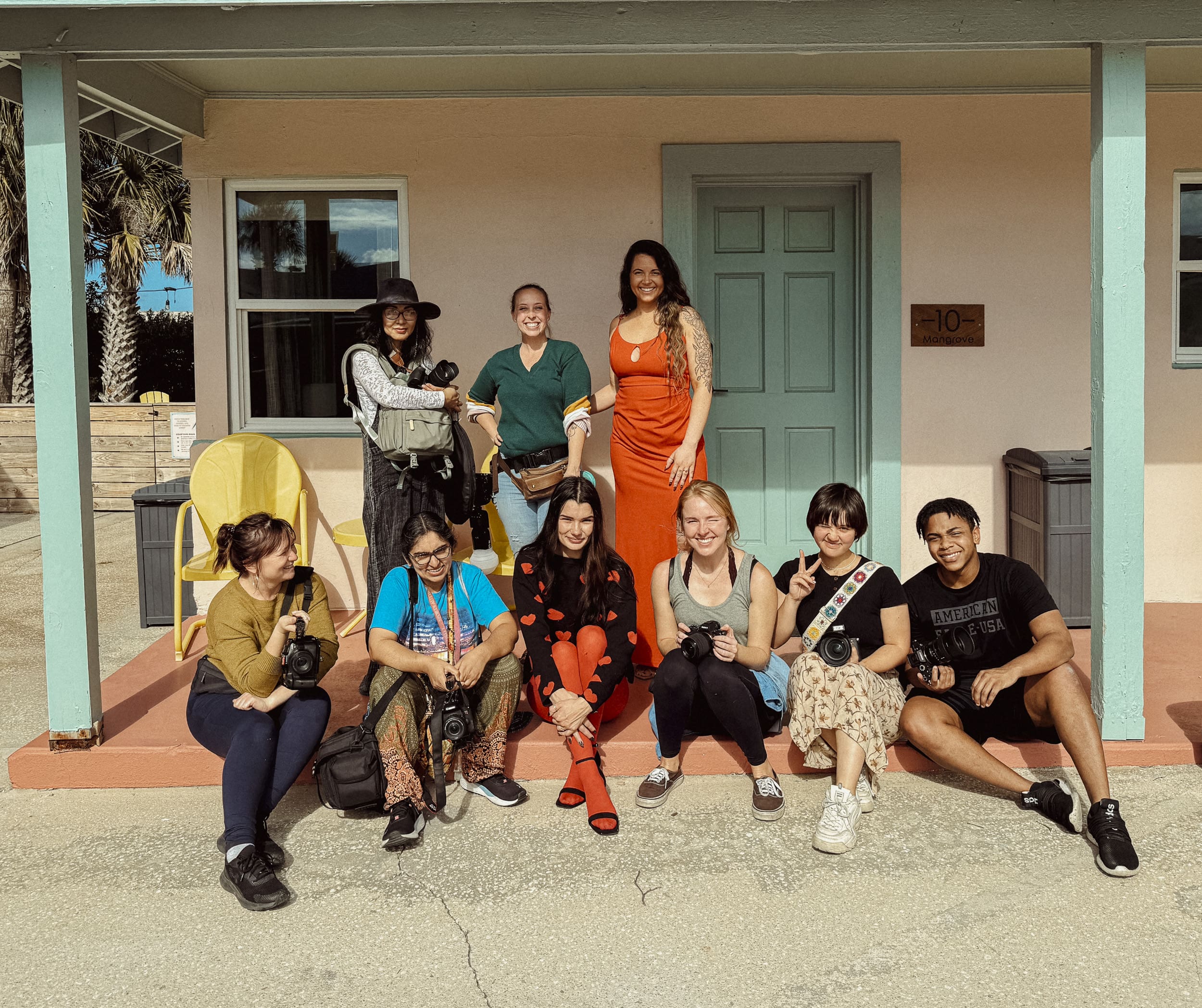 Group of photographers and creatives gathered outside during a Creative Hours photography workshop in St. Augustine, learning together in a supportive community setting