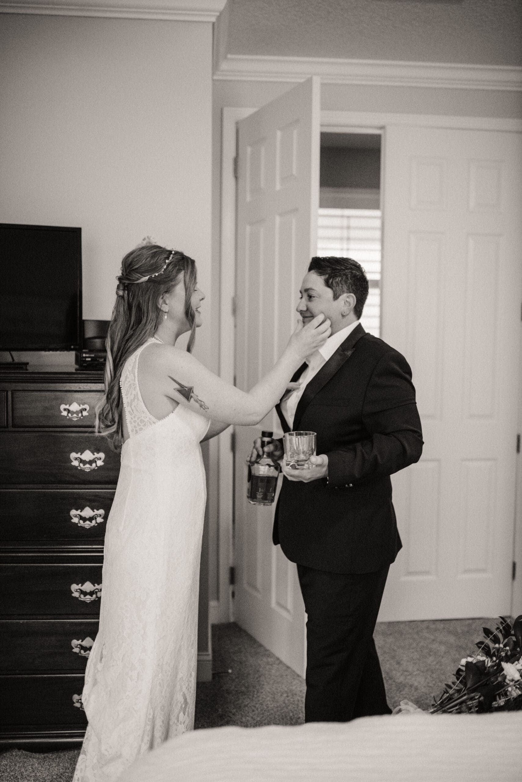Couple sharing a quiet getting ready moment during their intimate wedding day.