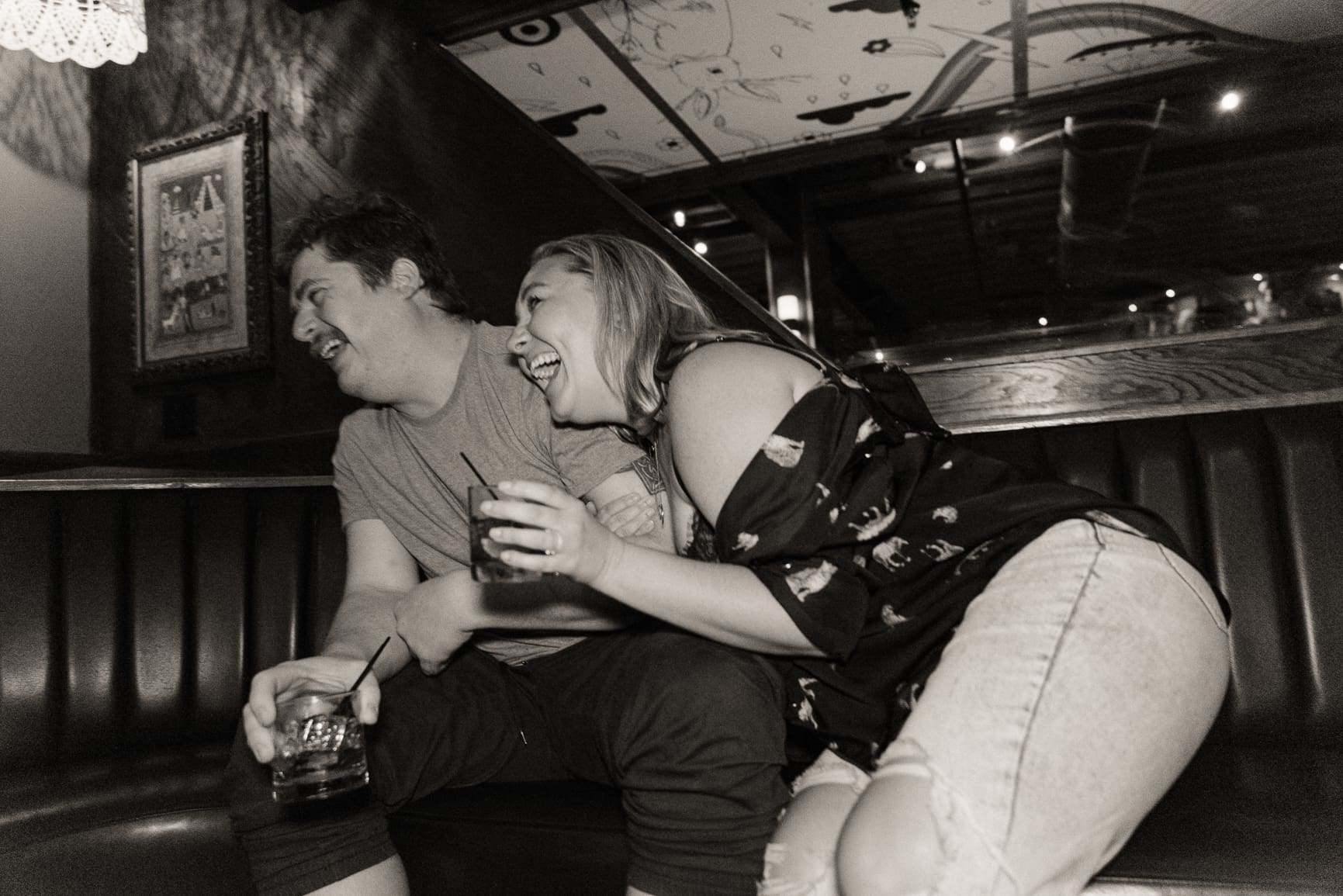 Candid moment of a couple laughing together during a relaxed couples photography session focused on connection