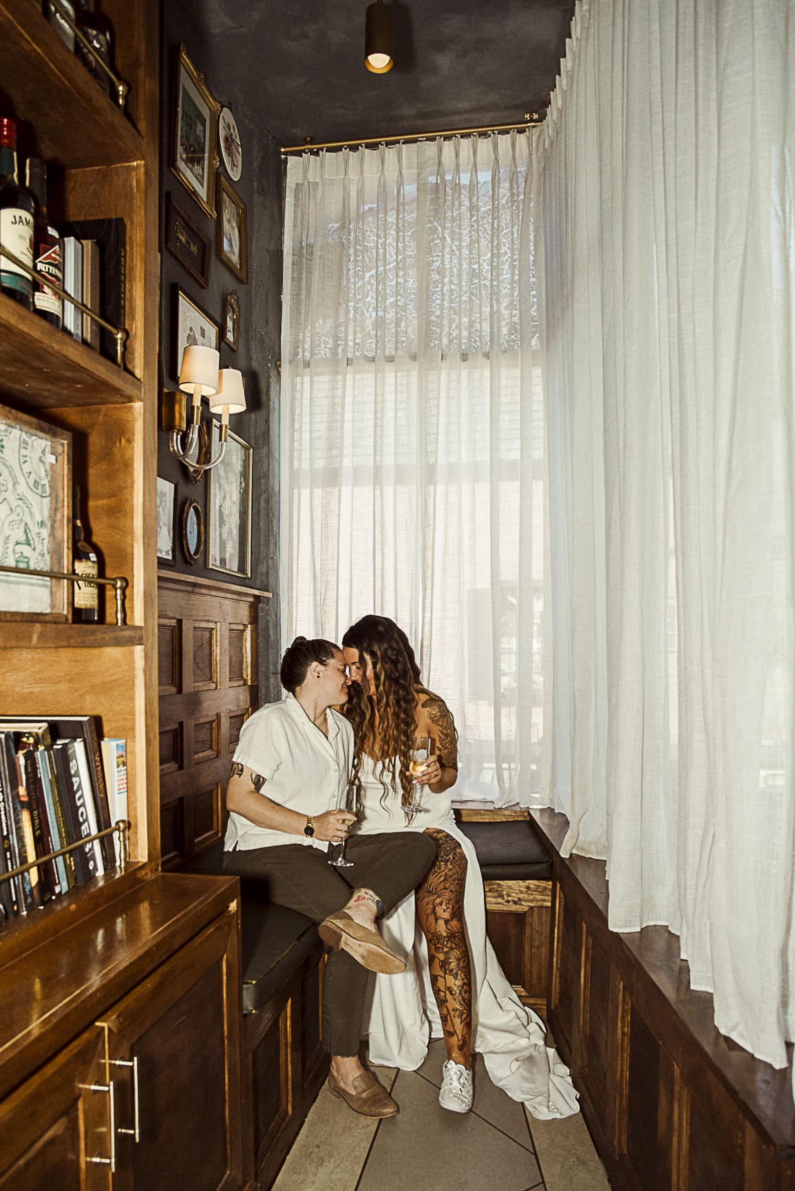 Couple sharing champagne during an intimate non traditional wedding celebration in St. Augustine, Florida