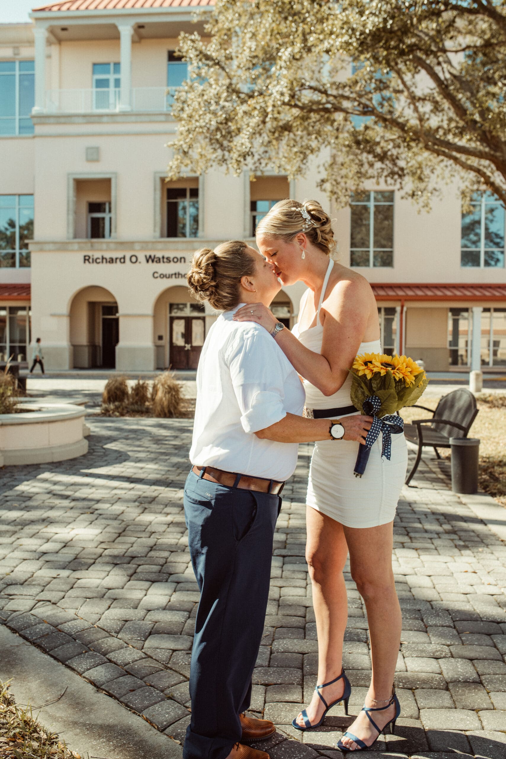 Couple kissing outside the Richard O Watson Courthouse after their intimate St. Augustine wedding ceremony.