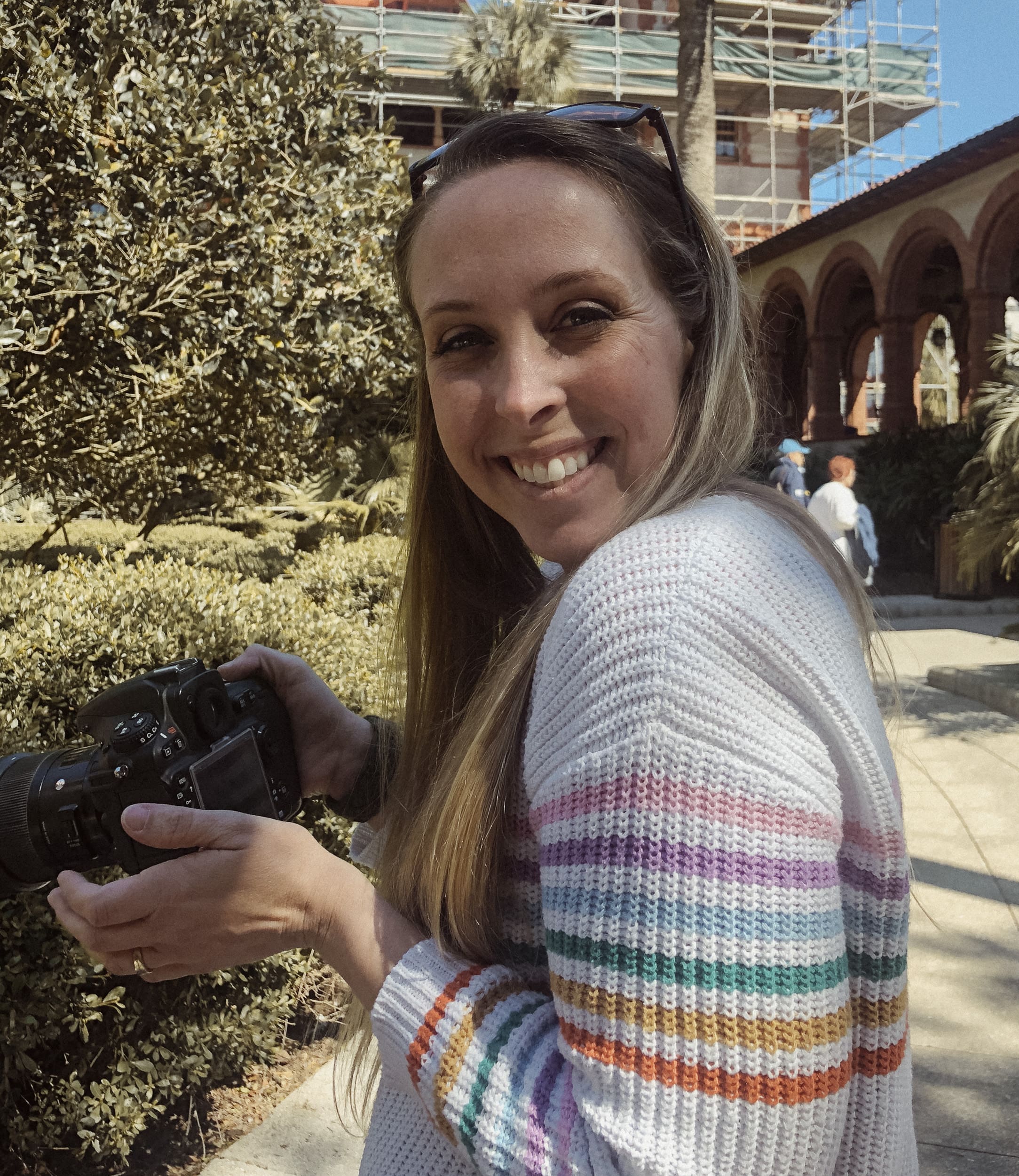Portrait of photography mentor Brandi Denslow holding her camera during a mentoring session in St. Augustine, Florida