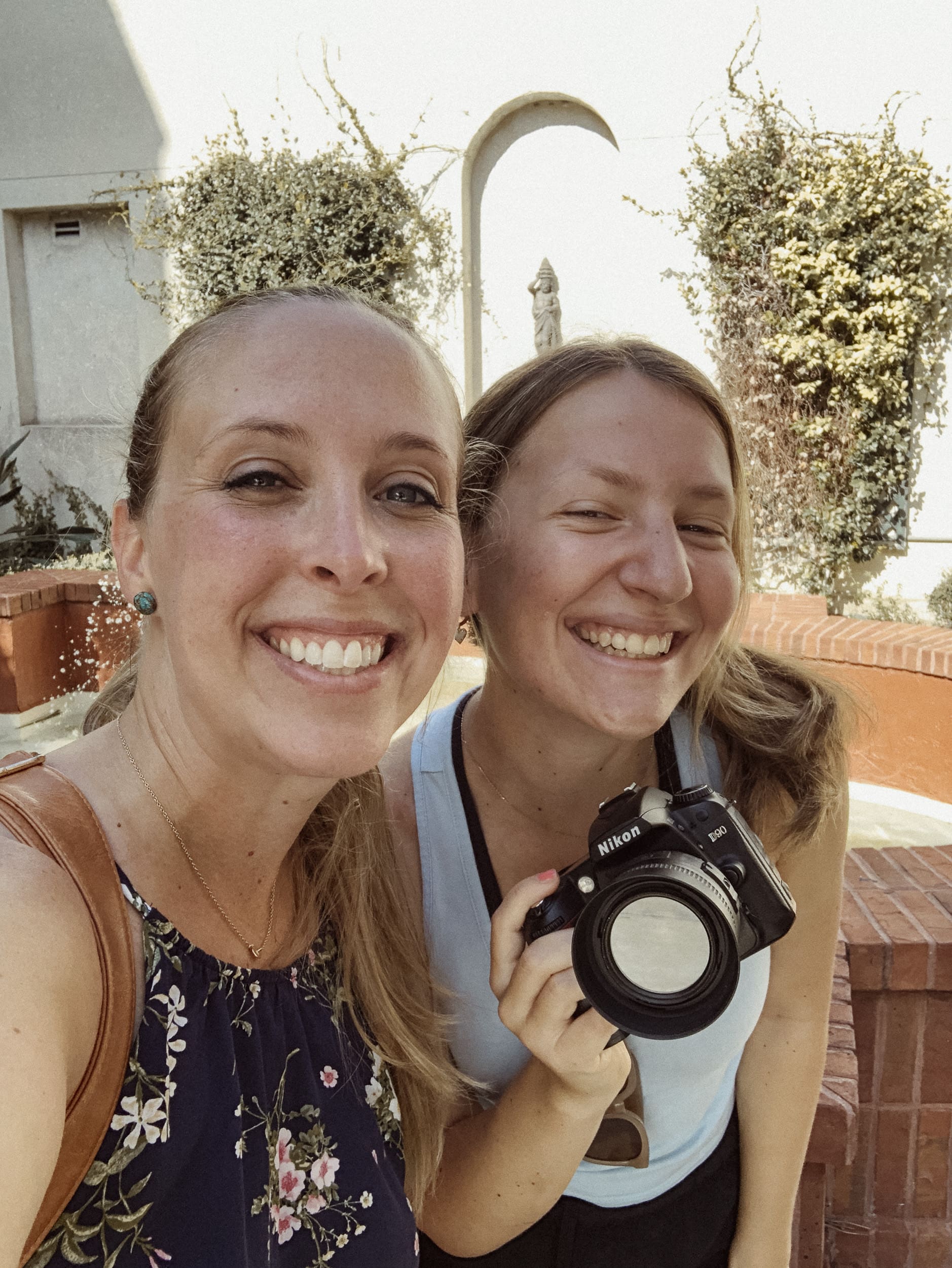 Brandi Denslow smiling with a photography mentee during a one-on-one mentorship session, highlighting a supportive and relaxed learning environment
