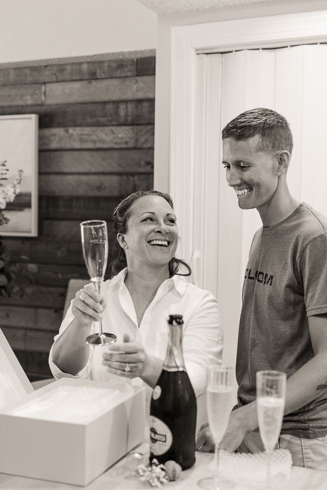 Couple celebrating their St. Augustine elopement with champagne after their intimate wedding ceremony.