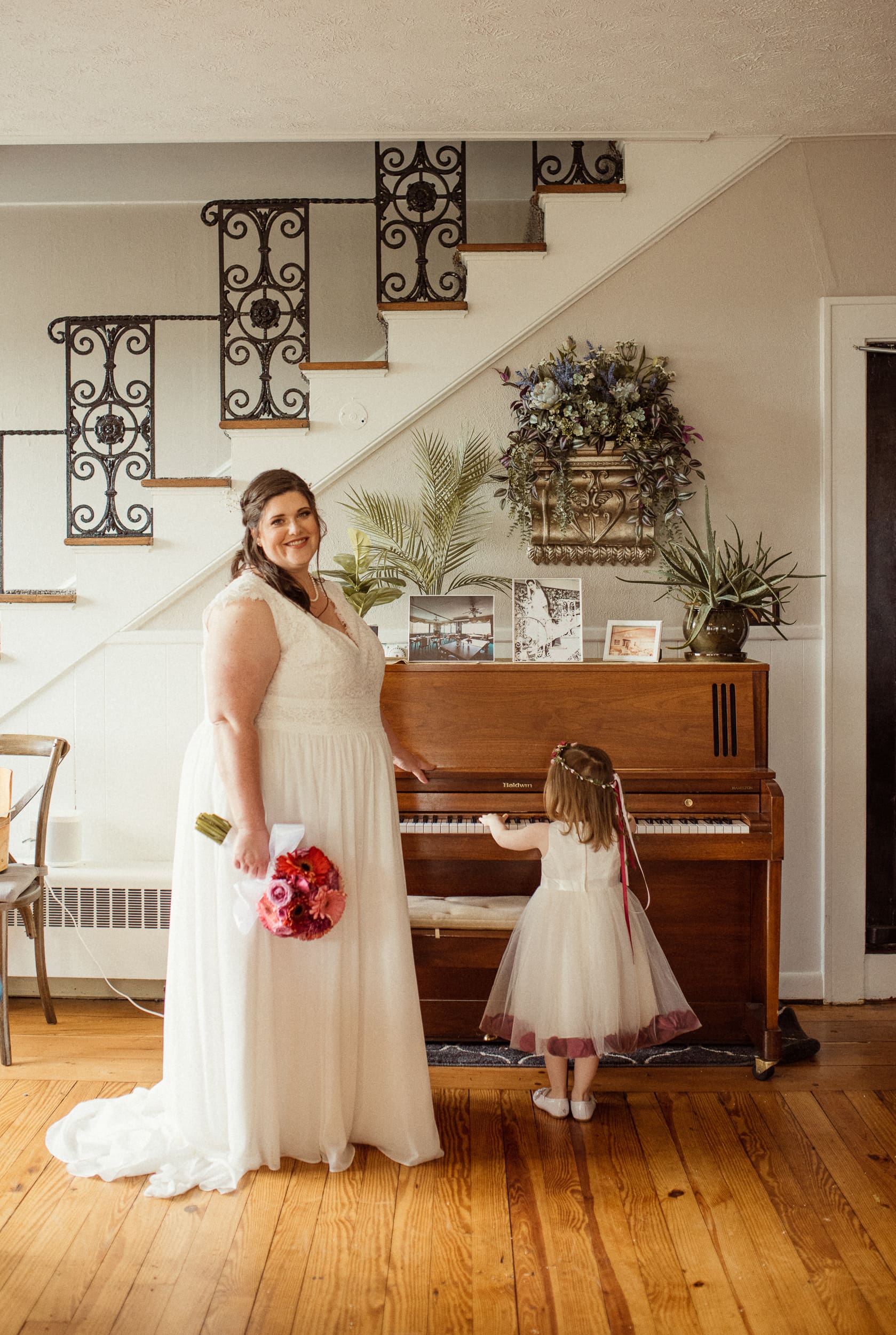 Bride standing with her daughter during quiet getting ready moments at an intimate North Carolina wedding. 