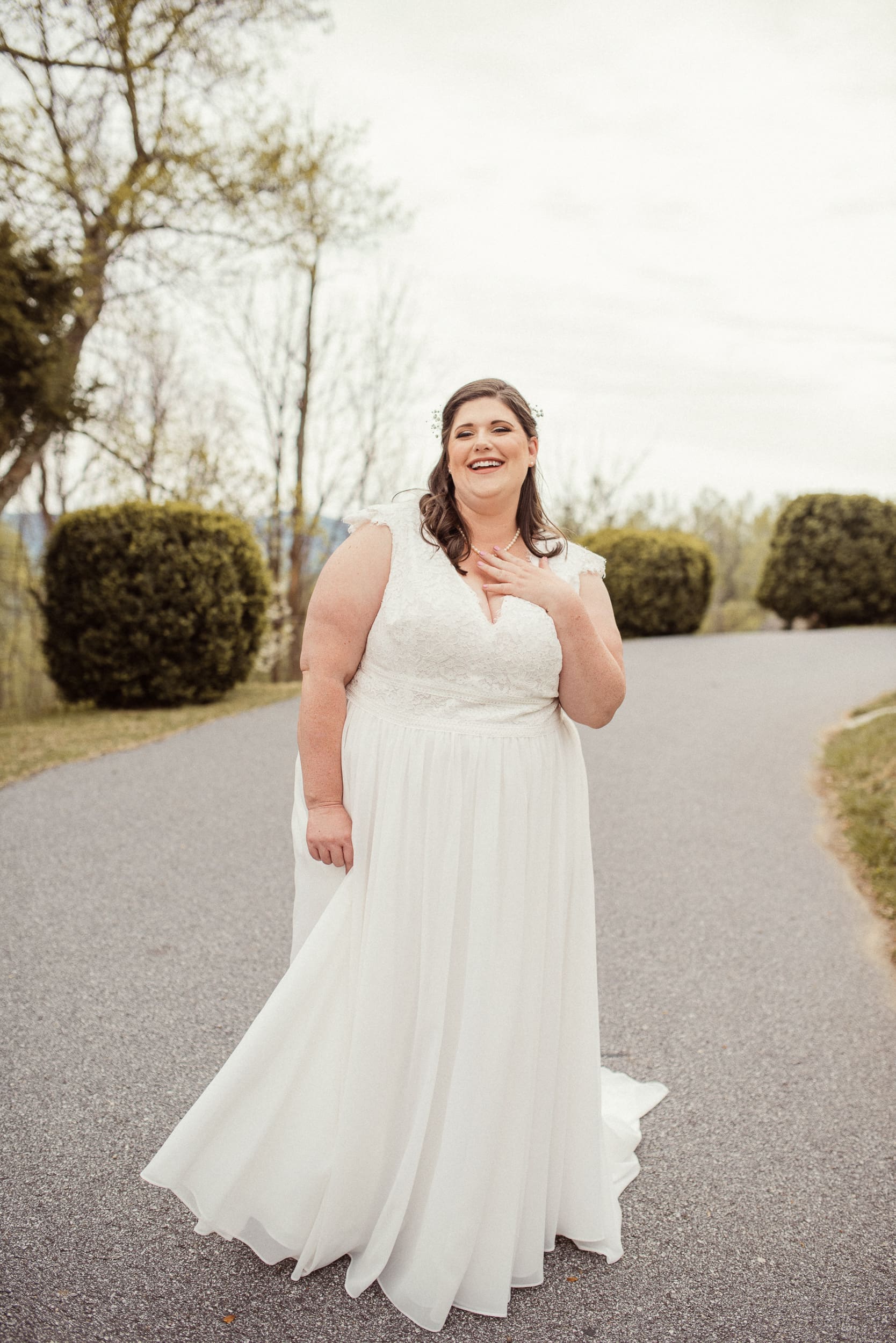 Bride smiling during outdoor portrait session at Blue Ridge mountain wedding.