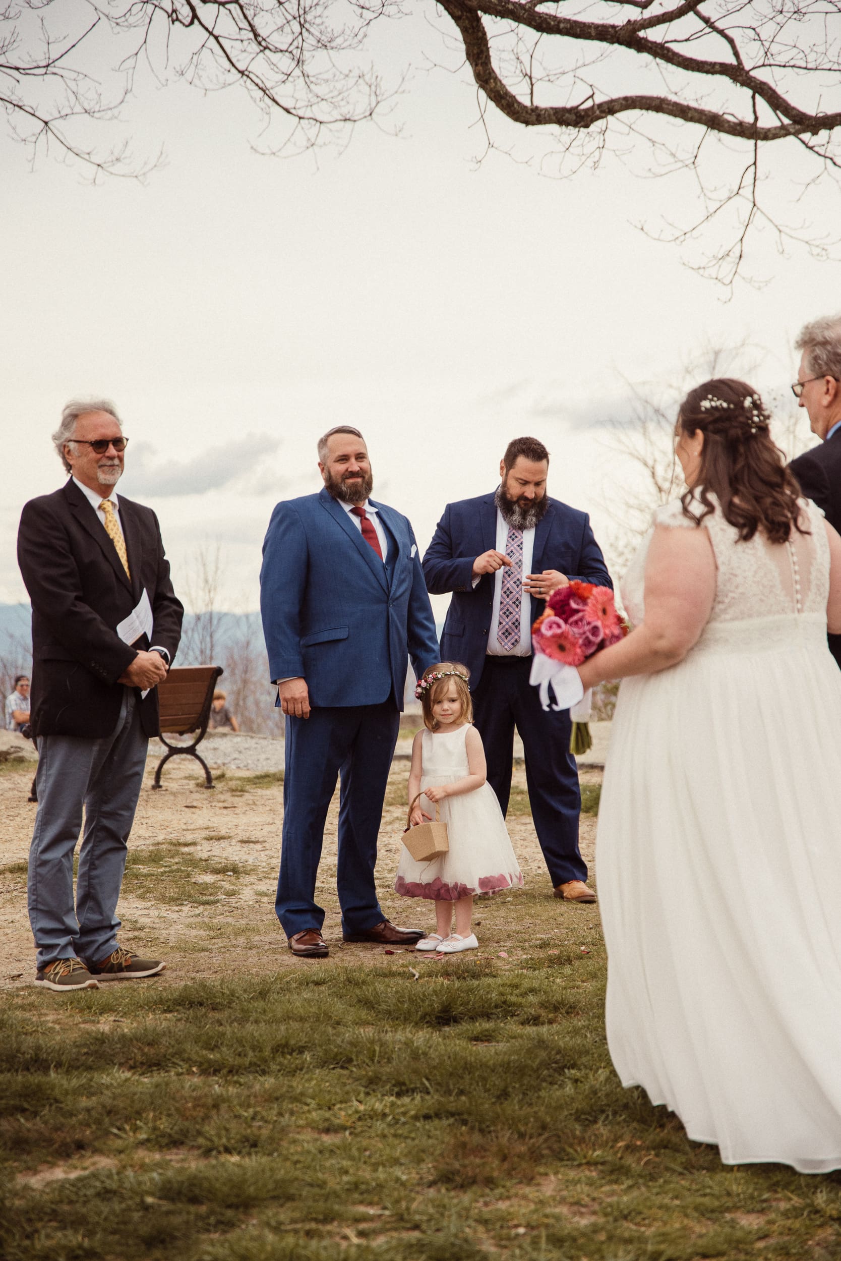 Groom waiting with guests during an intimate mountain wedding ceremony overlooking the Blue Ridge Mountains