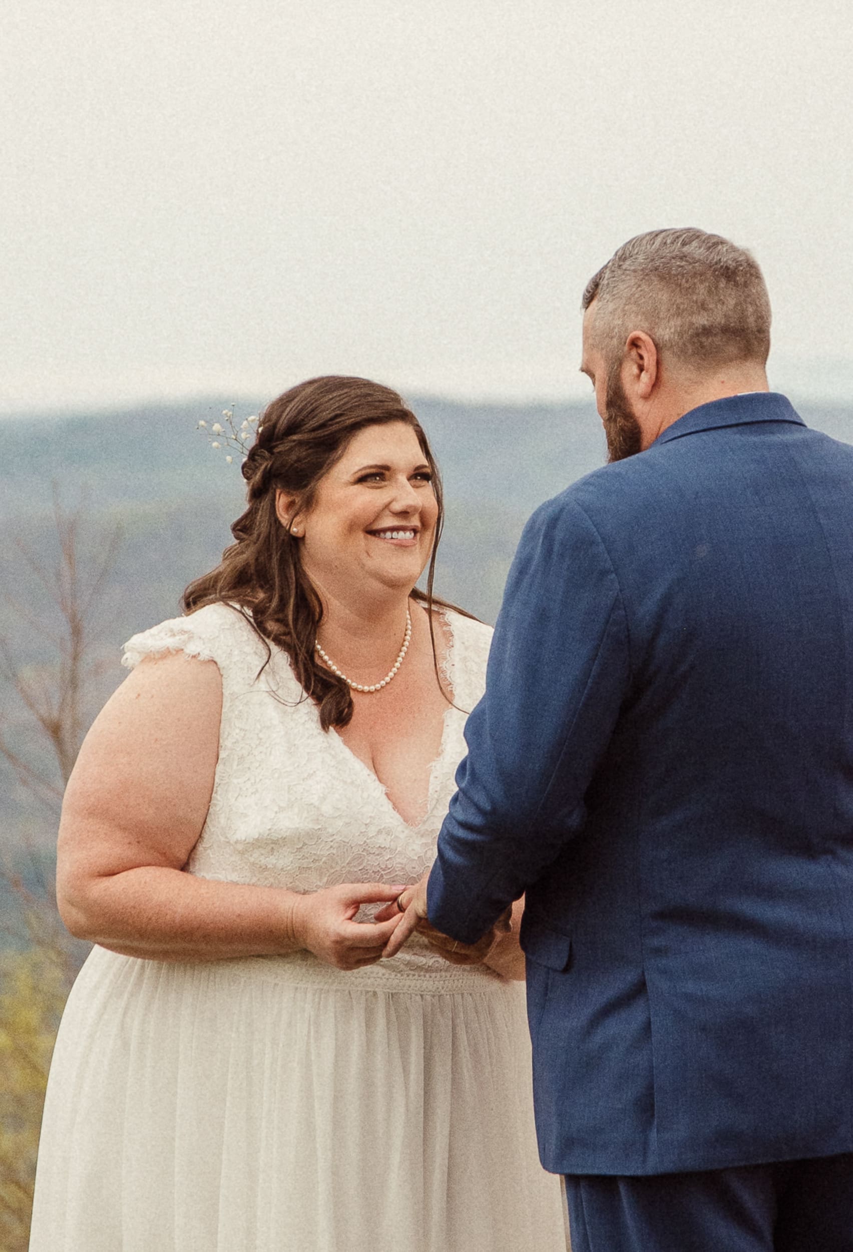 Bride smiling during vows at intimate mountain wedding ceremony in North Carolina