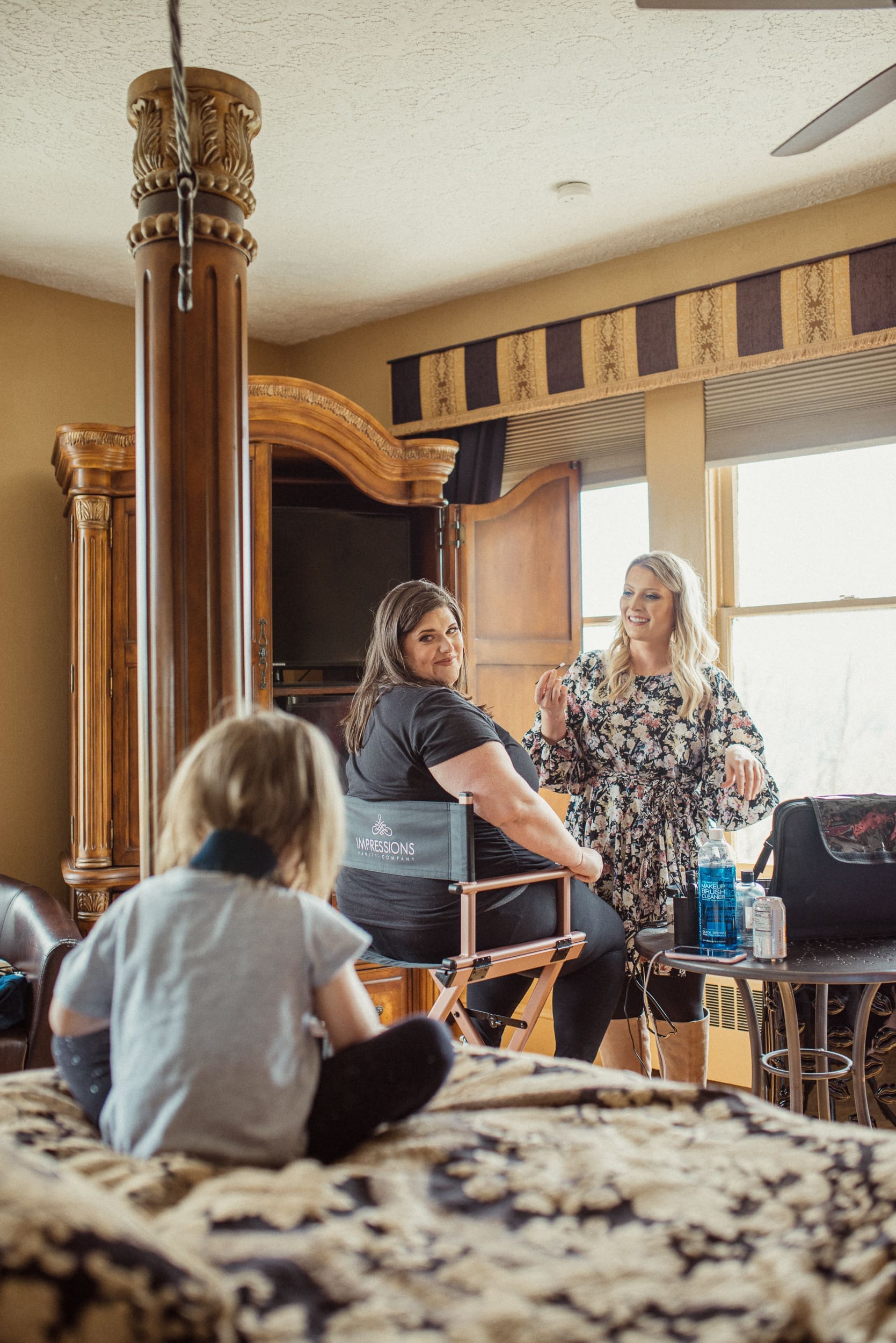 Bride getting ready with family during intimate North Carolina mountain wedding morning. 