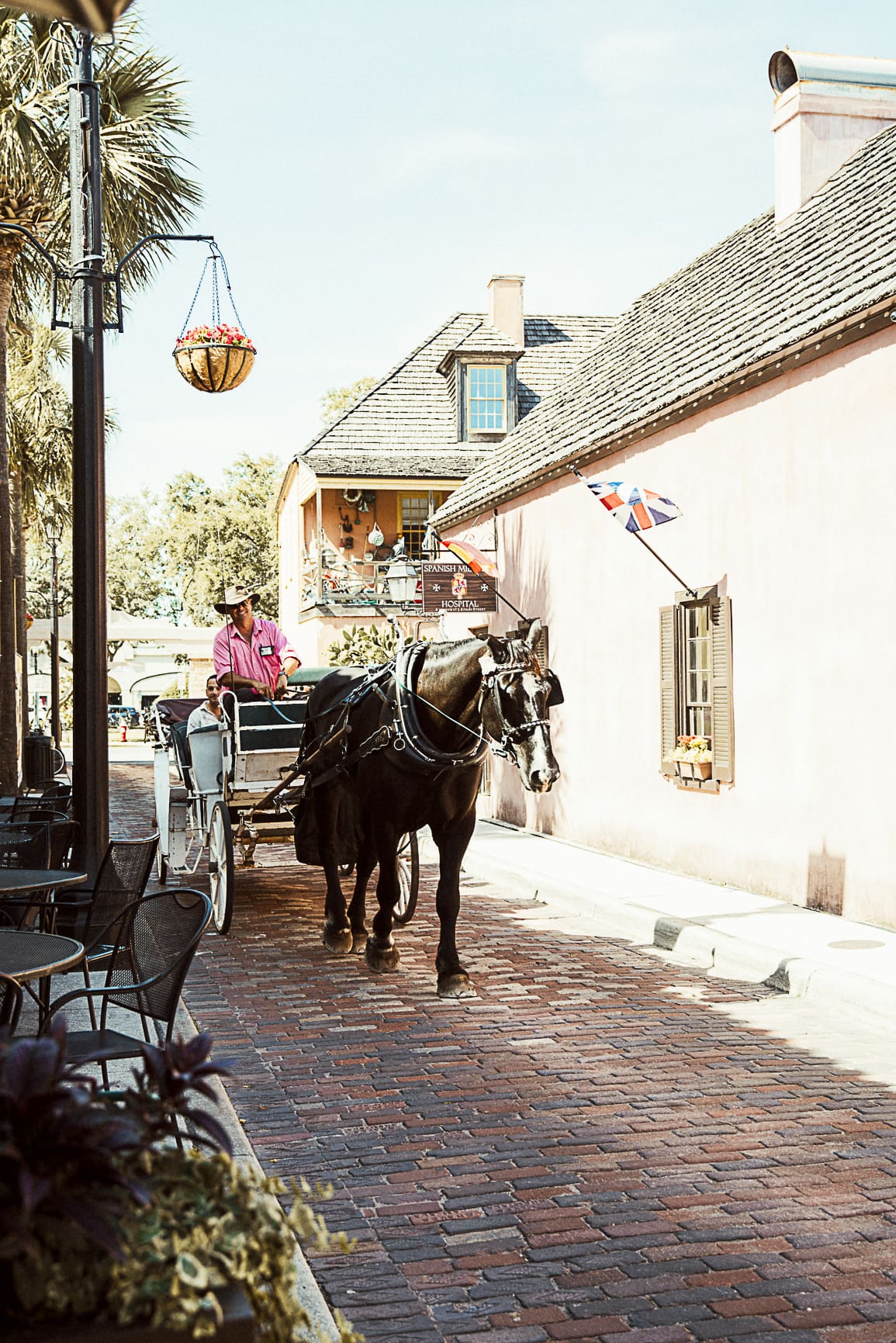 Historic carriage traveling through downtown St. Augustine near popular elopement photo locations. 