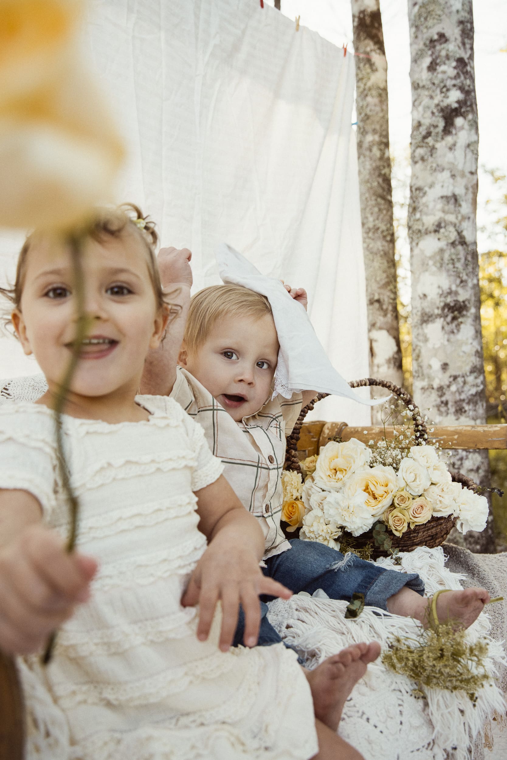 children exploring their backyard during a relaxed family photo session