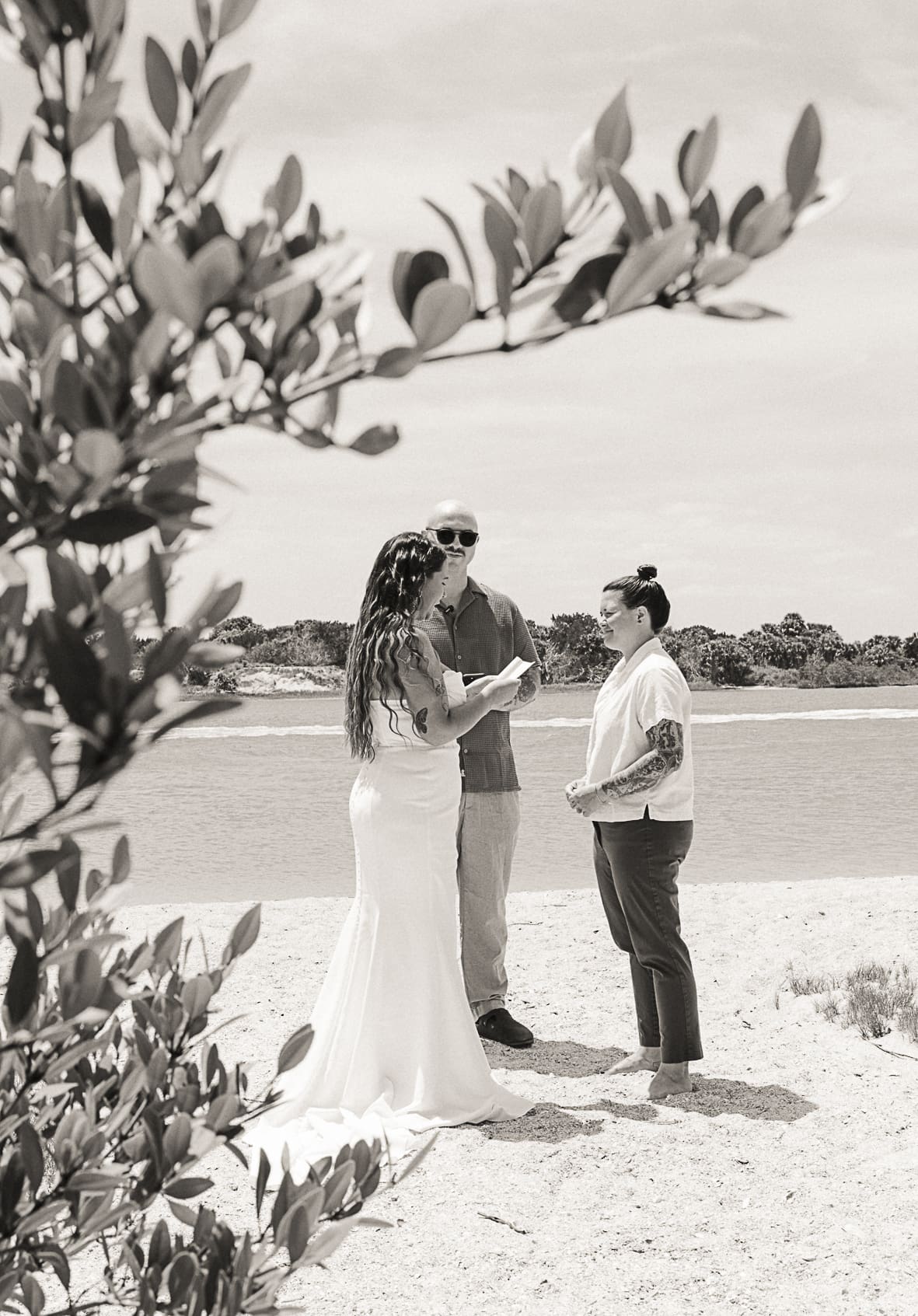 Black and white photo of a small beach elopement ceremony in St. Augustine. 