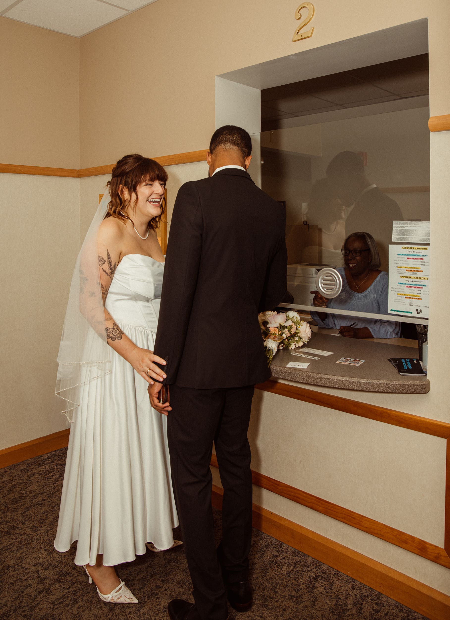 Couple at clerk window during St Johns County courthouse wedding ceremony. 