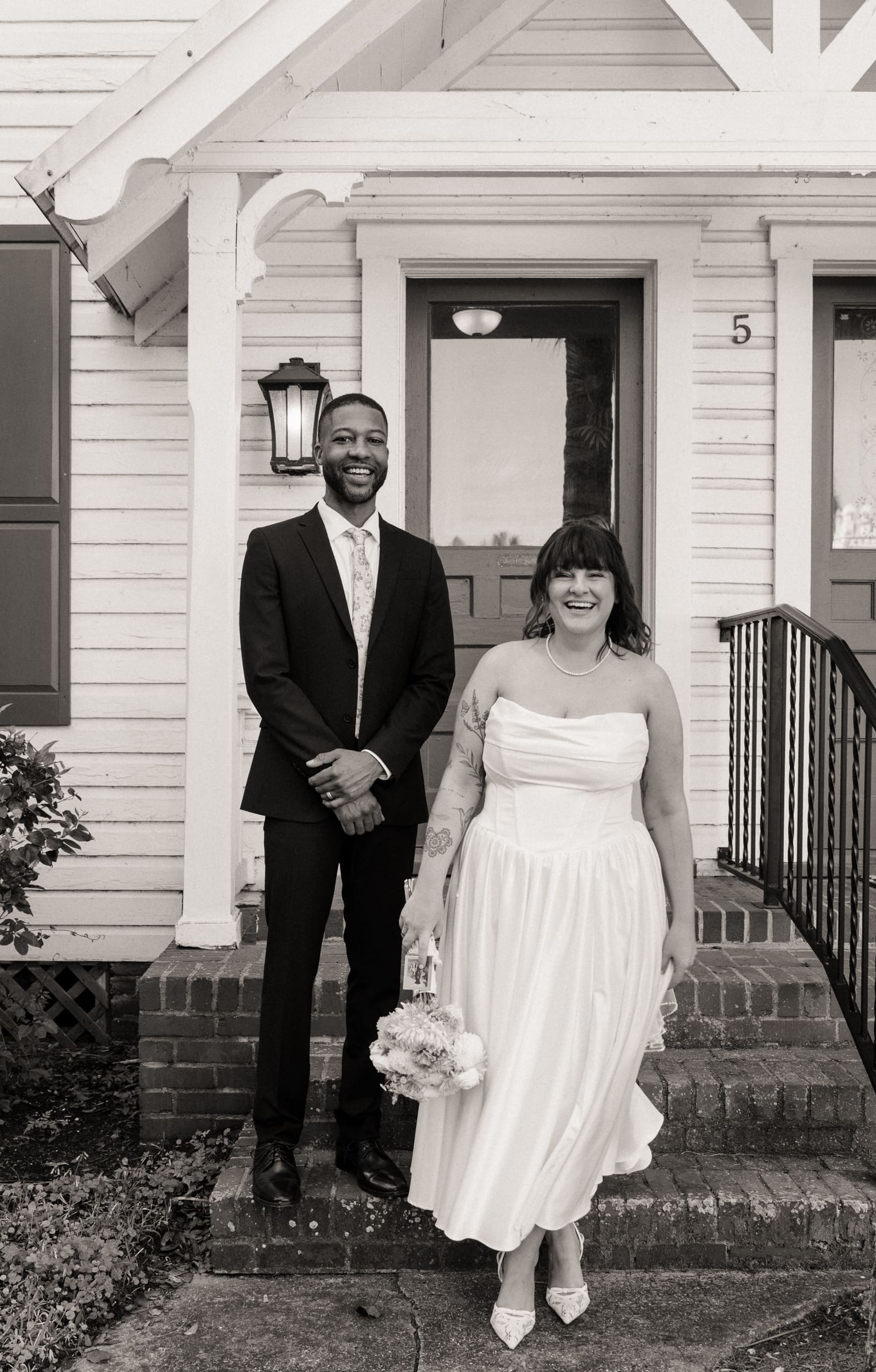 Couple posing in historic downtown St Augustine after courthouse elopement. 
