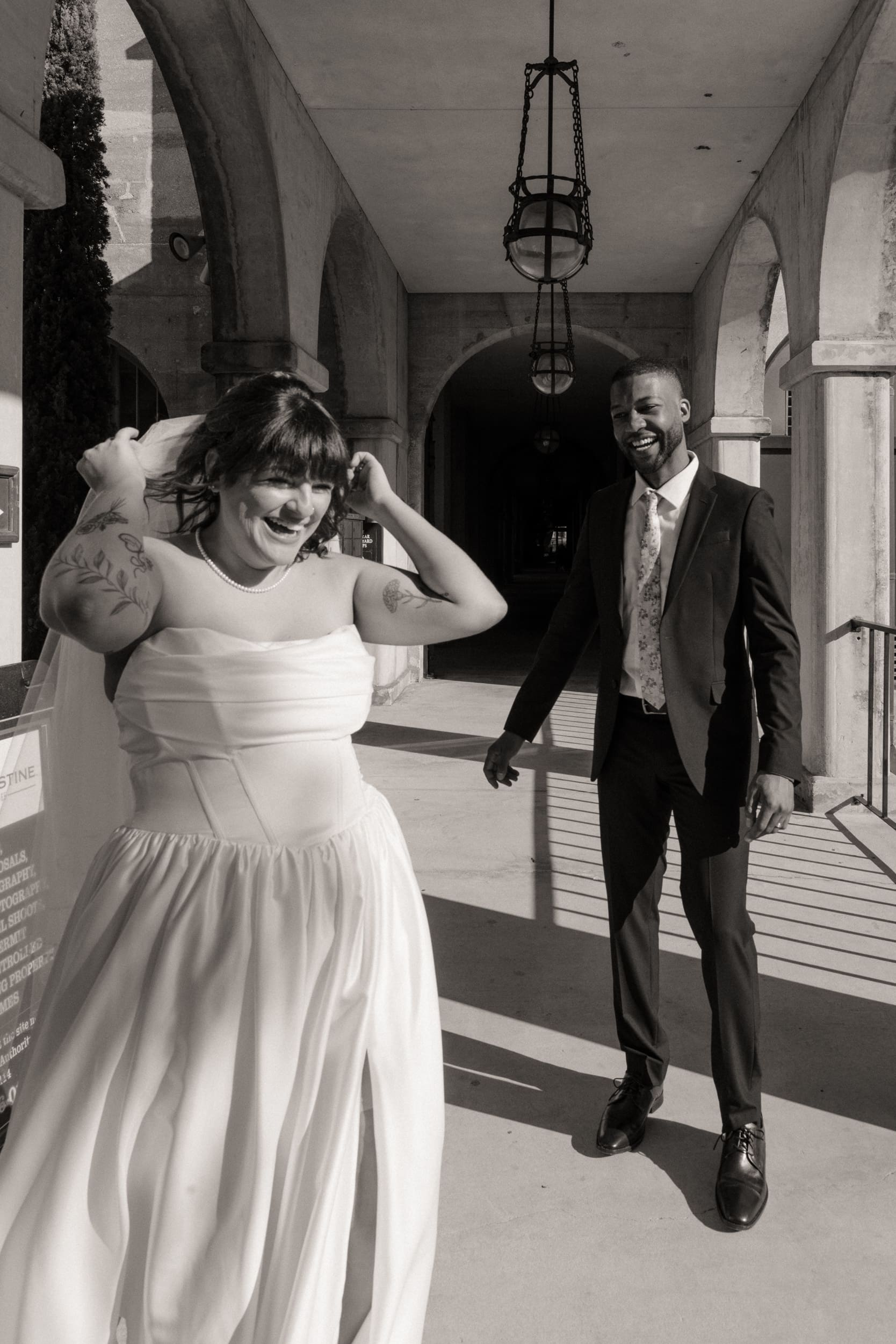 Bride laughing during candid moment at Lightner Museum elopement in St Augustine.