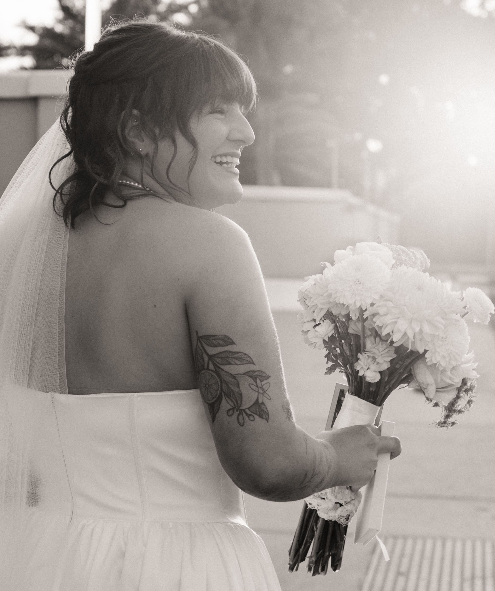 Bride holding bouquet in soft light after Lightner Museum elopement in St Augustine. 