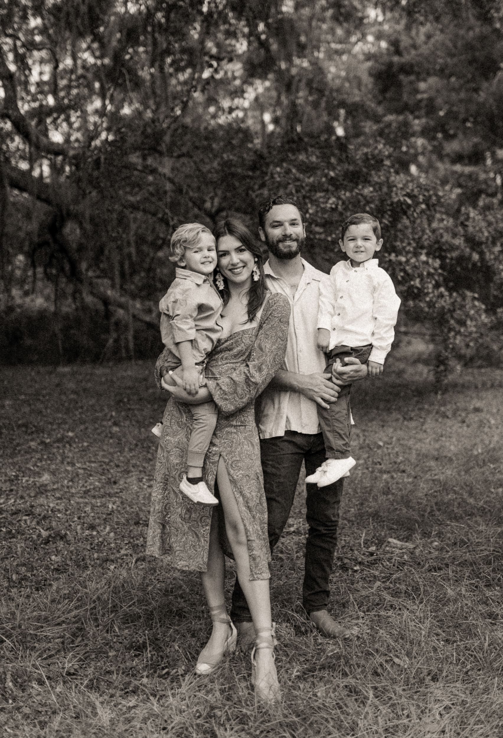 Family portrait during backyard engagement session in Jacksonville with natural light and candid emotion.