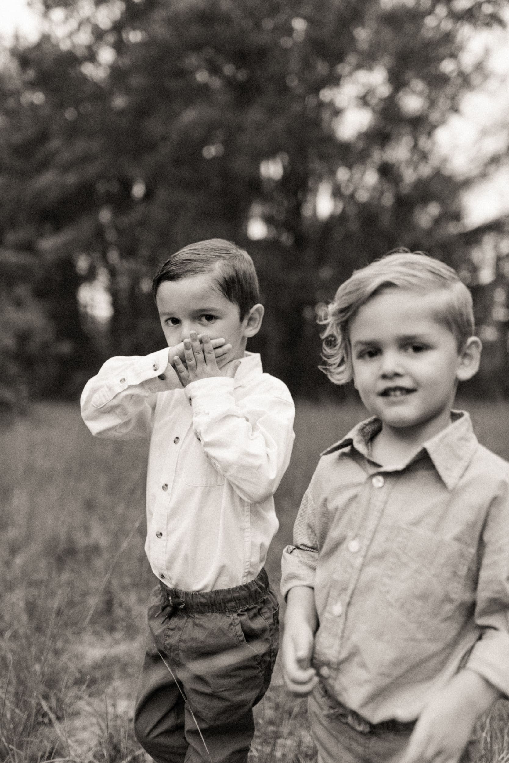 Black and white portrait of children during backyard engagement session in Jacksonville.