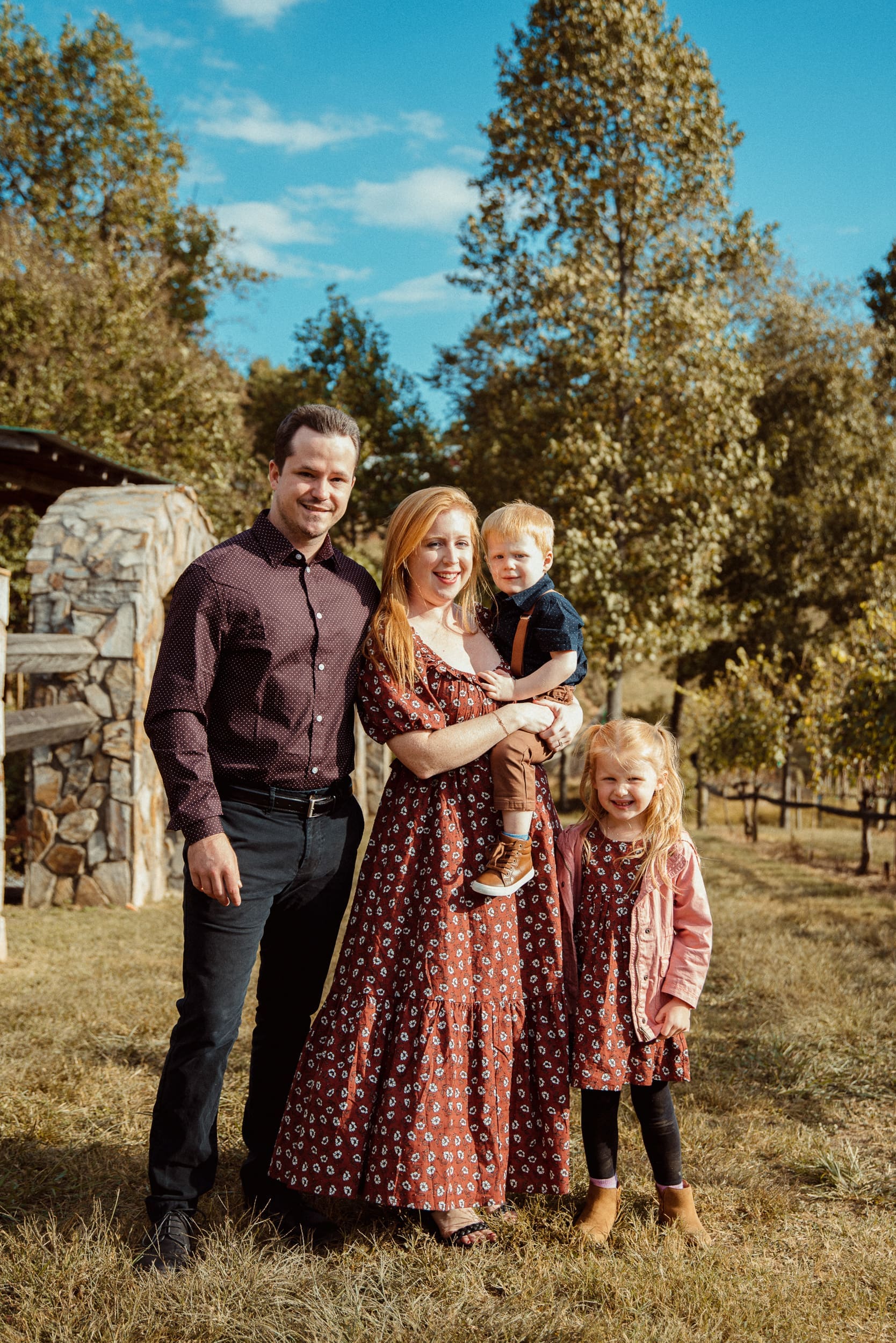 Family portrait with young children during Parker-Binns Vineyard wedding celebration in North Carolina, photographed by Brandi Denslow. 