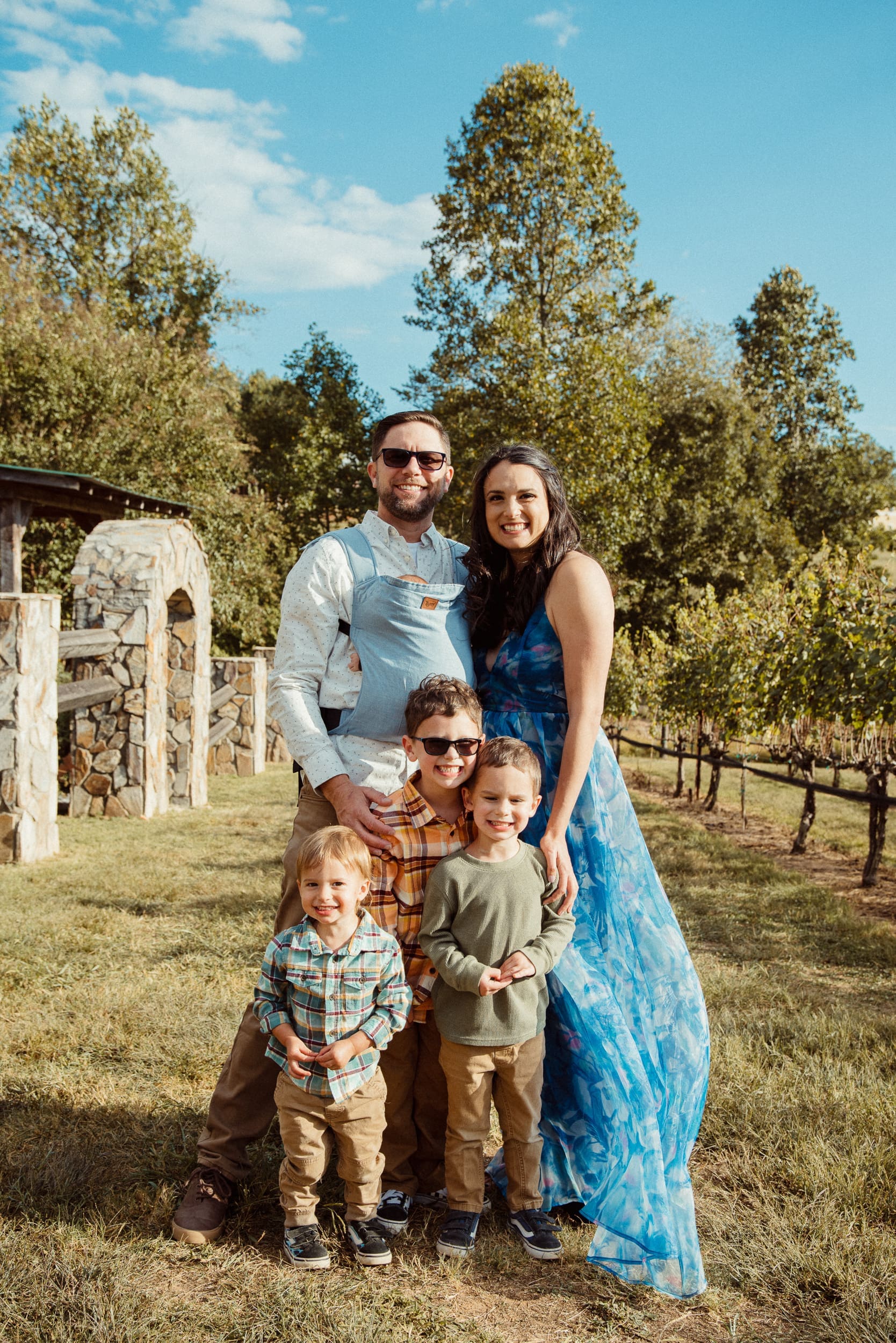 Family portrait with three young boys at Parker-Binns Vineyard wedding in North Carolina. 