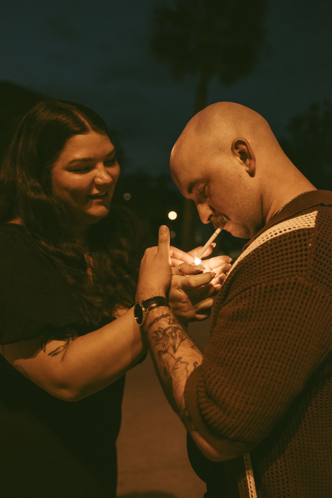 Intimate close-up of an engaged couple sharing a quiet moment during a night engagement session in Florida.