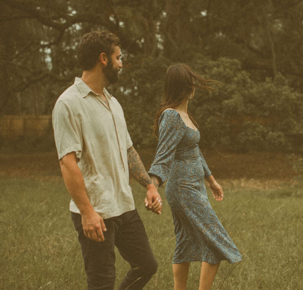 Couple walking together during a movement-focused editorial portrait session. 