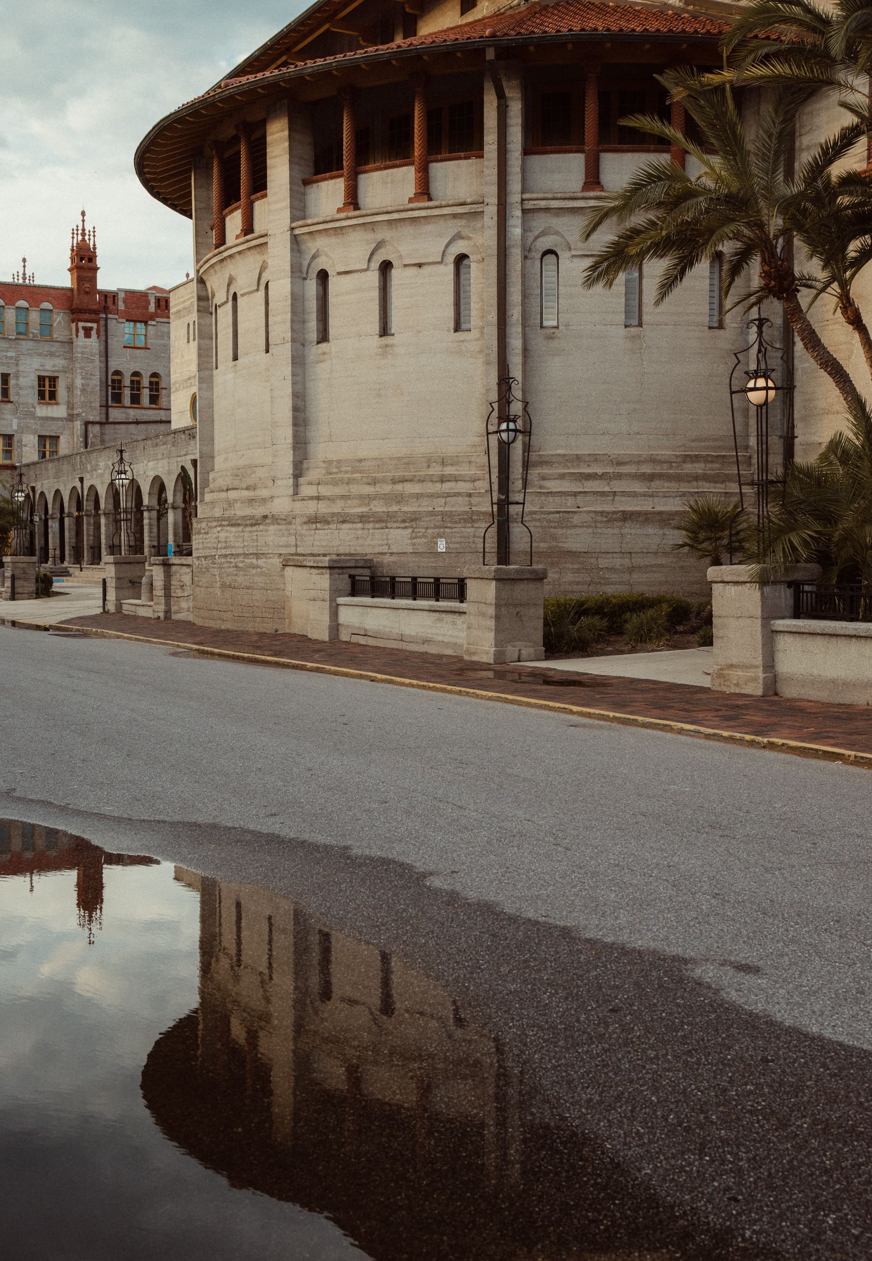 Historic St. Augustine rotunda building framed by palm trees during a photography workshop