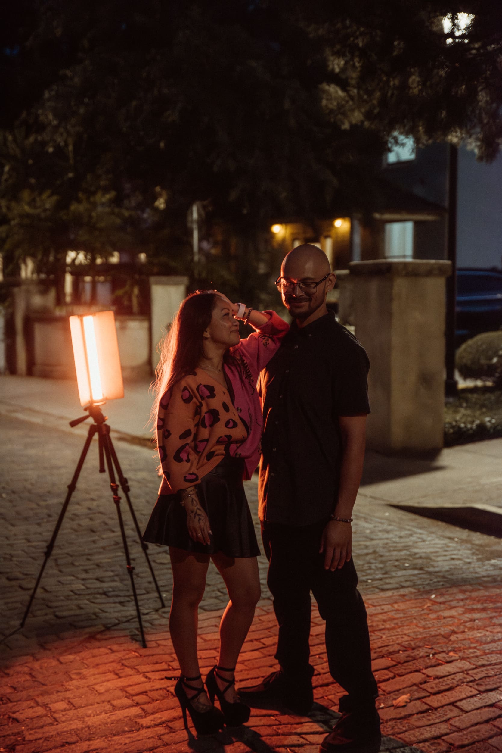 Couple sharing a laugh together during a night photography session in St. Augustine