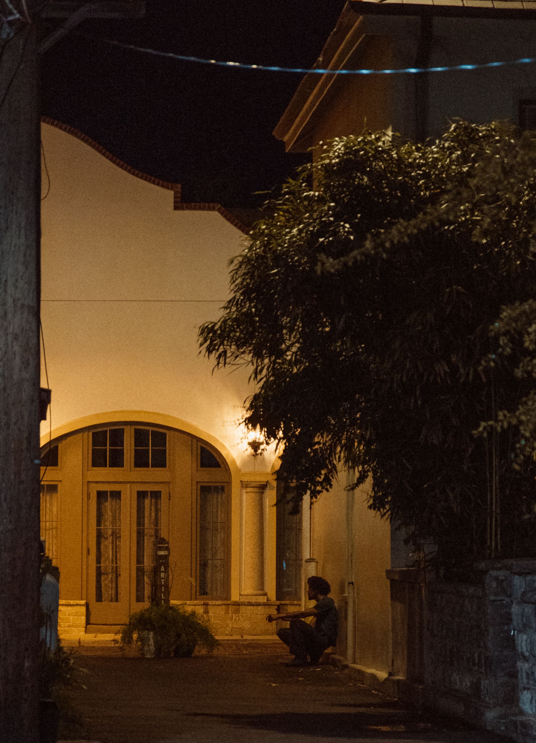 Close-up of feet on St. Augustine's brick streets during a night photography workshop