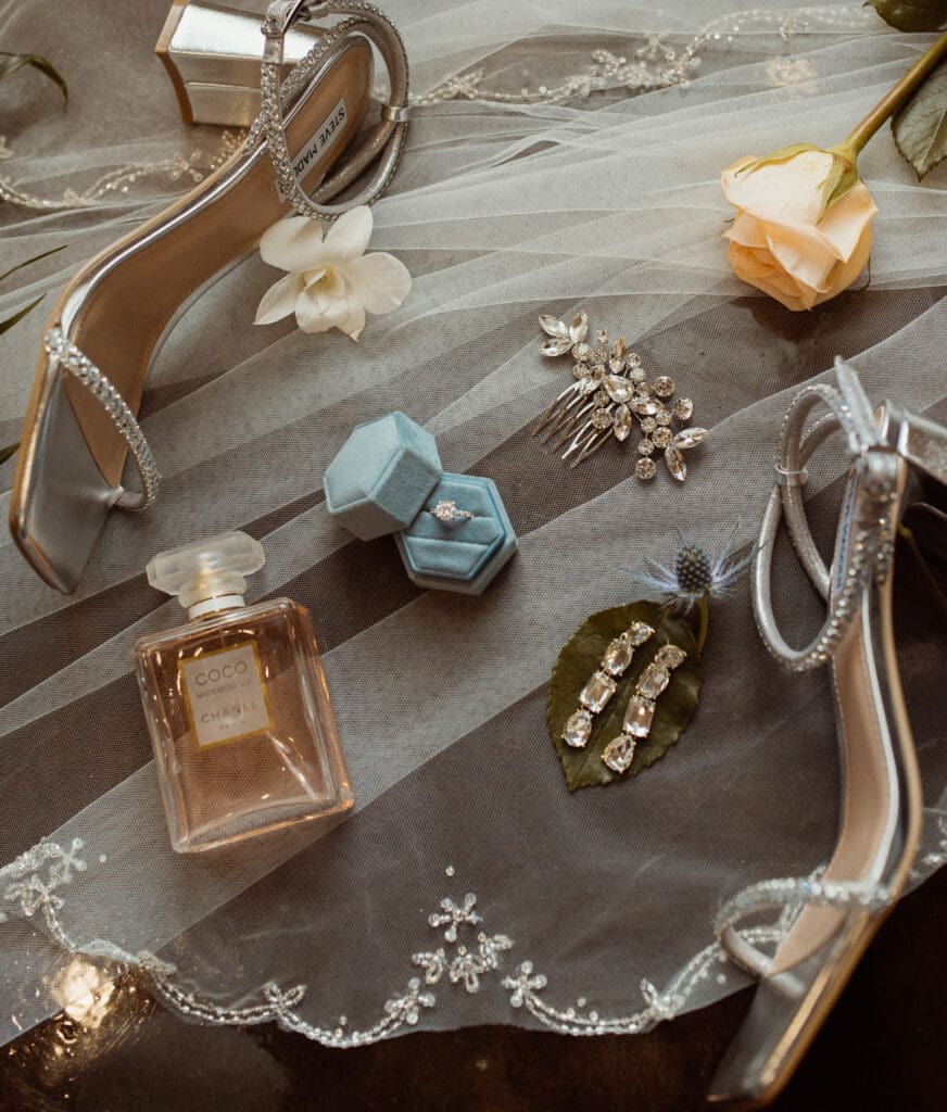Bridal details flay lay featuring shoes, perfume, and jewelry for a Jacksonville wedding. 