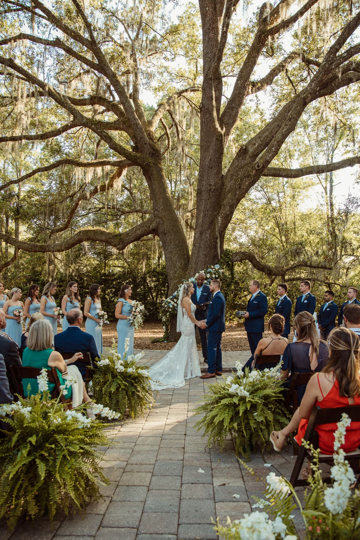 Jacksonville wedding ceremony beneath a massive live oak at Bowing Oaks Plantation. 