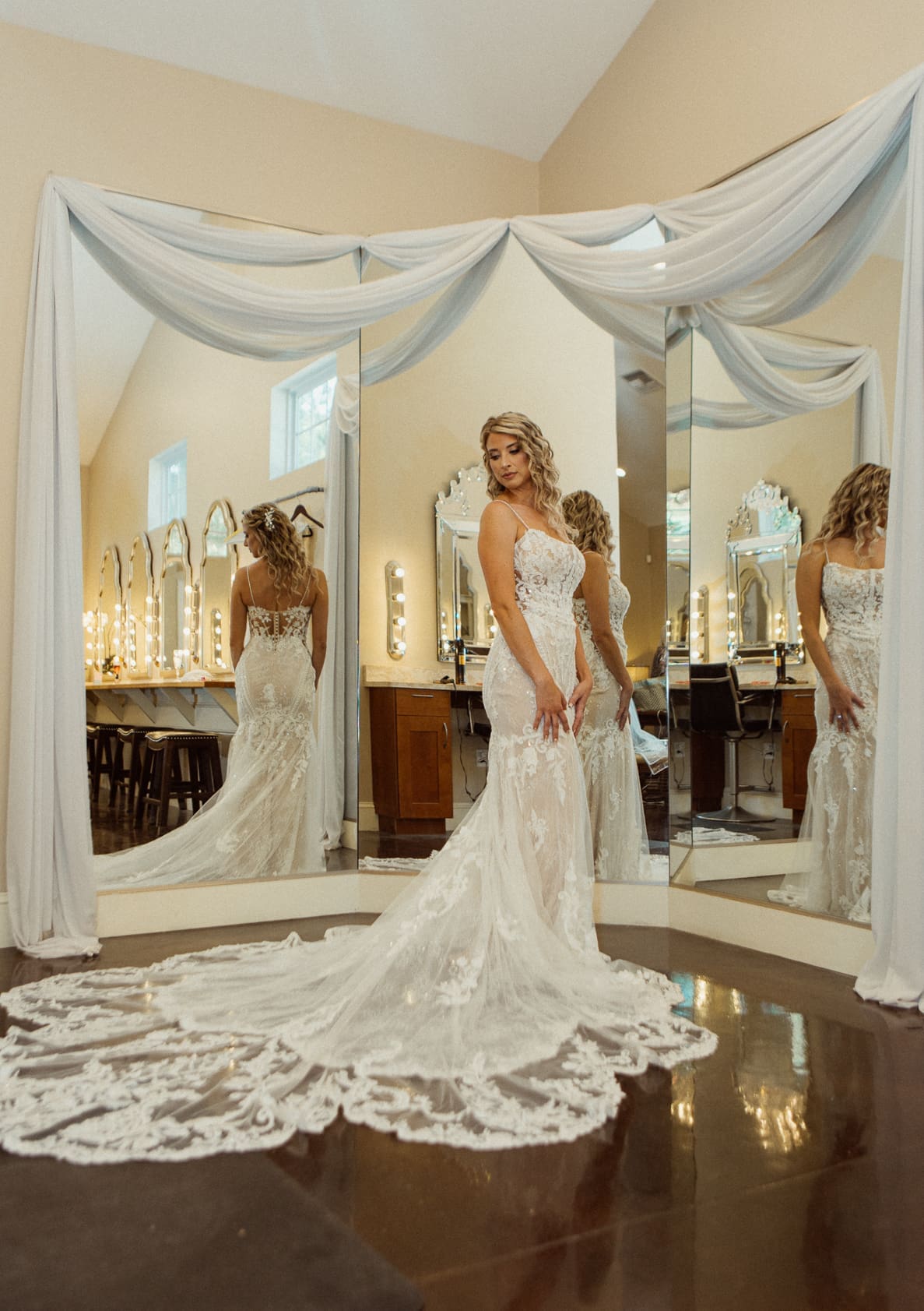 Bride viewed in a mirror reflection wearing her wedding gown at Bowing Oaks. 