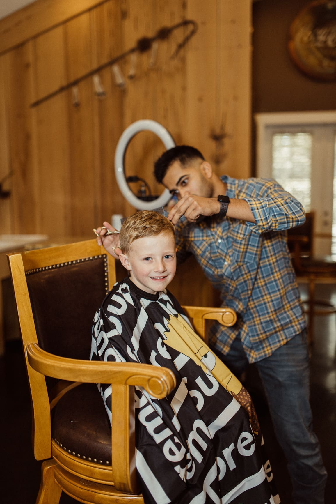 Ring bearer getting a haircut before the wedding. 